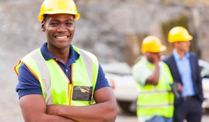 Man smiling on work site