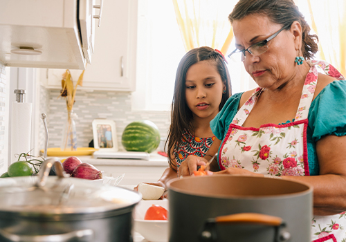 mother and daughter cooking